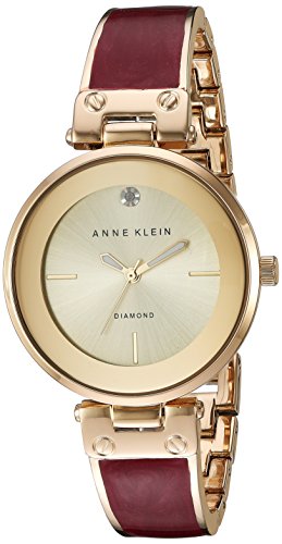 Product Cover Anne Klein Women's AK/2512BYGB Diamond-Accented Gold-Tone and Burgundy Marbleized Bangle Watch